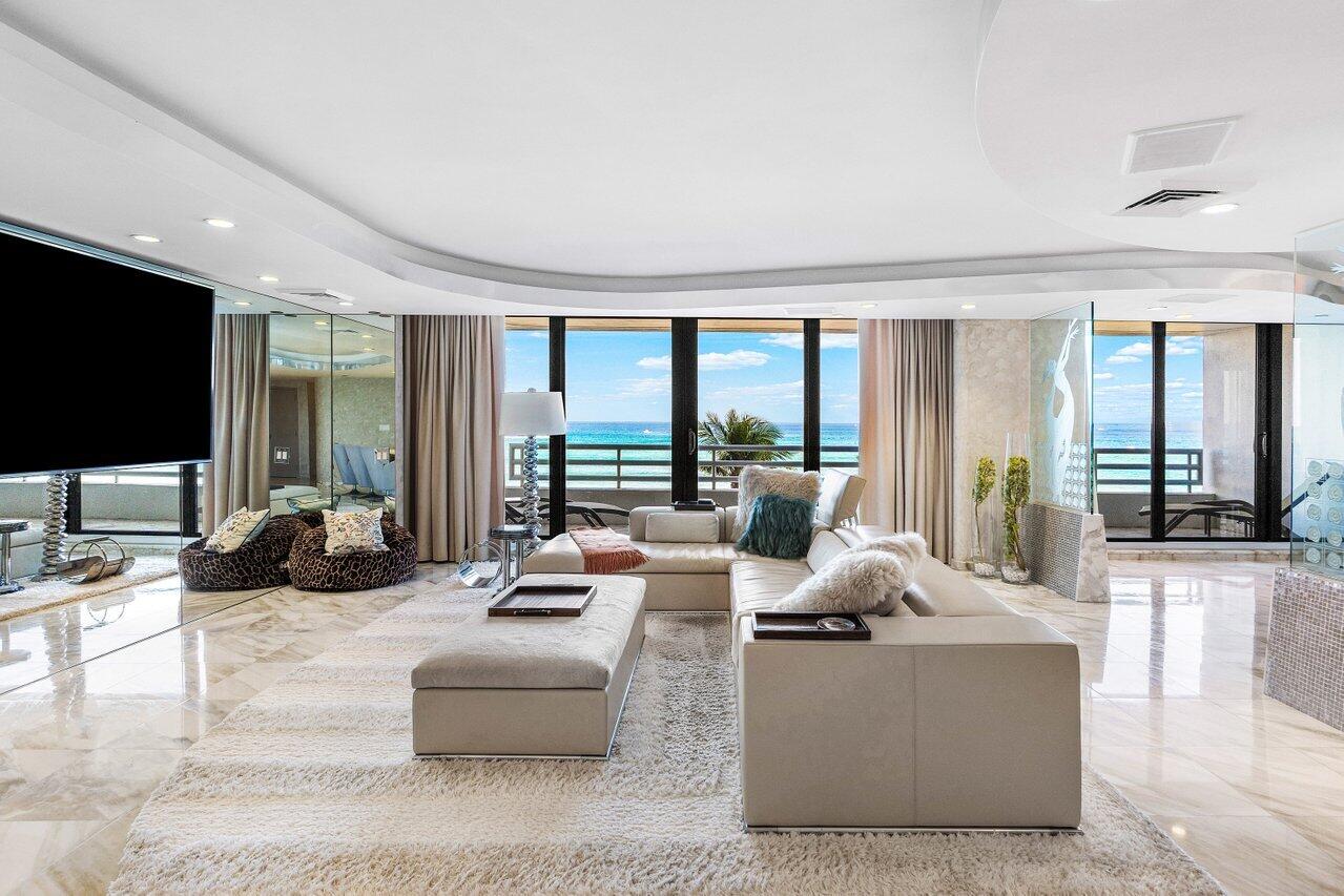 1500 South Ocean Boulevard, Unit 303/304 Boca Raton, FL 33432 - Photo 2 of 49 a living room with fireplace furniture and a flat screen tv