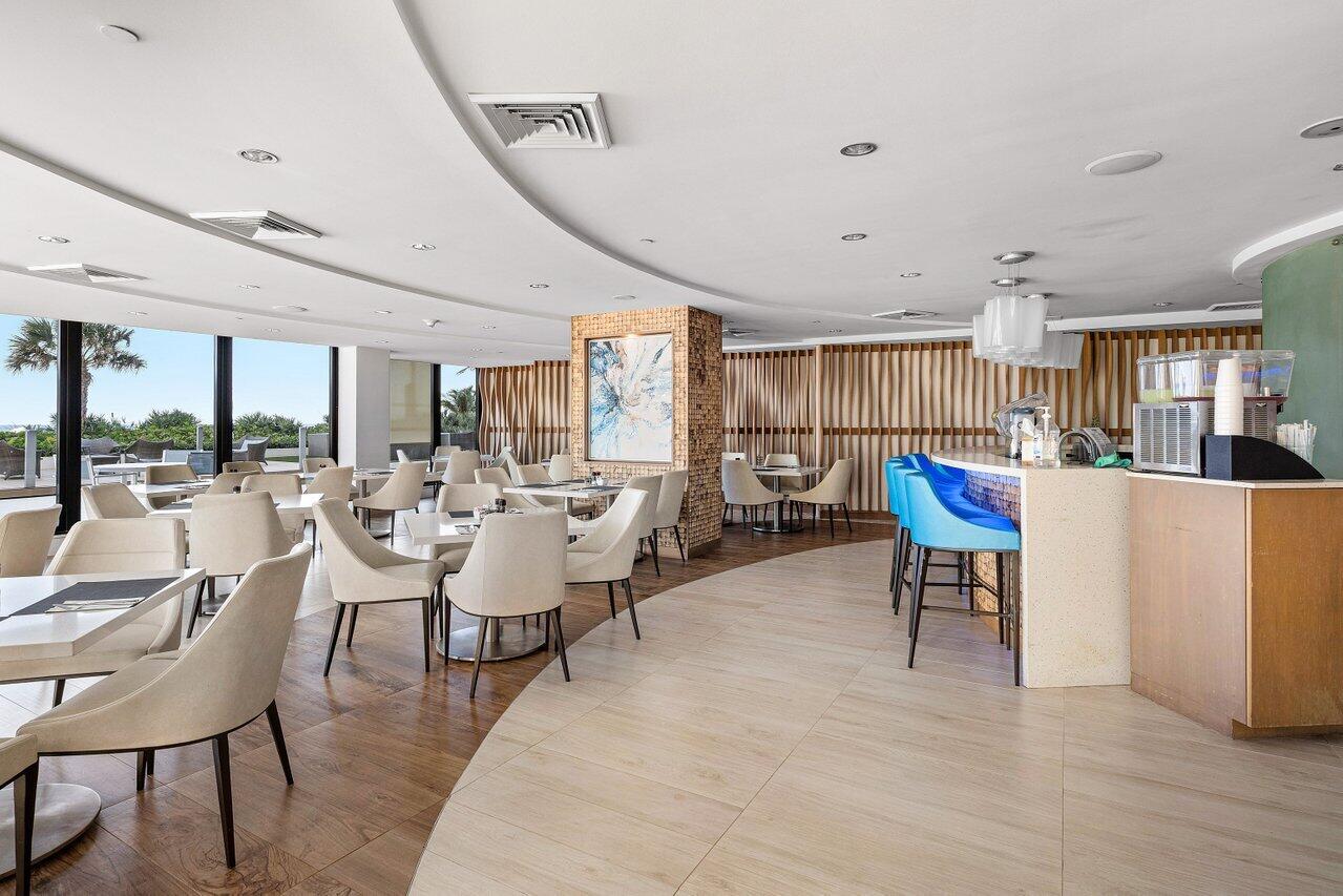 1500 South Ocean Boulevard, Unit 303/304 Boca Raton, FL 33432 - Photo 29 of 49 a living room with lots of furniture and view of kitchen