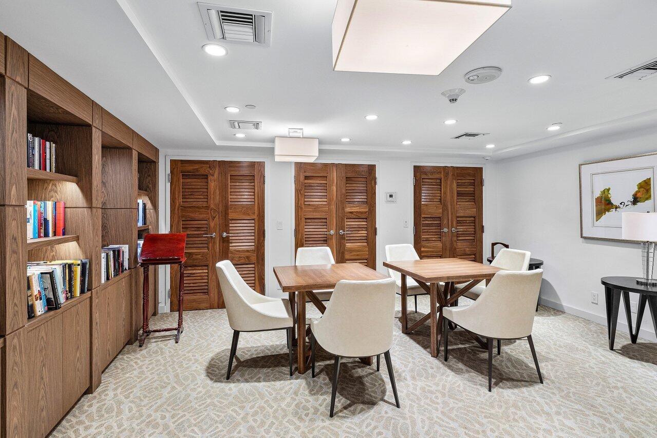 1500 South Ocean Boulevard, Unit 303/304 Boca Raton, FL 33432 - Photo 39 of 49 a dining room with furniture and a floor to ceiling window