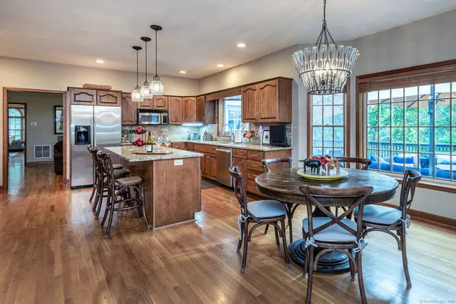 a view of a dining room with furniture window and wooden floor