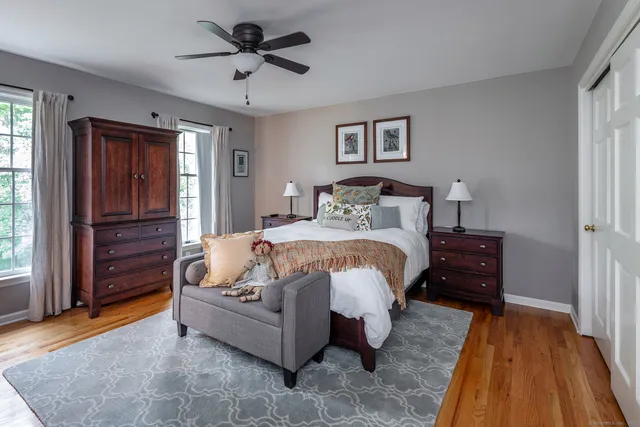a bed room with a bed and a chandelier