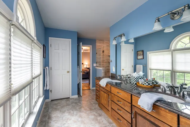 a room with furniture and large windows