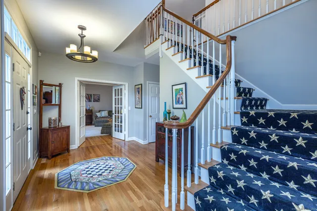 a living room with furniture and a rug