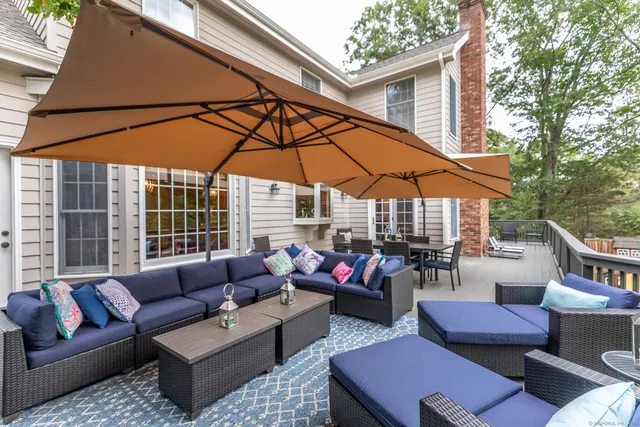 a outdoor space with patio the couches and a umbrella