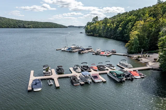 a view of a lake with boats and trees