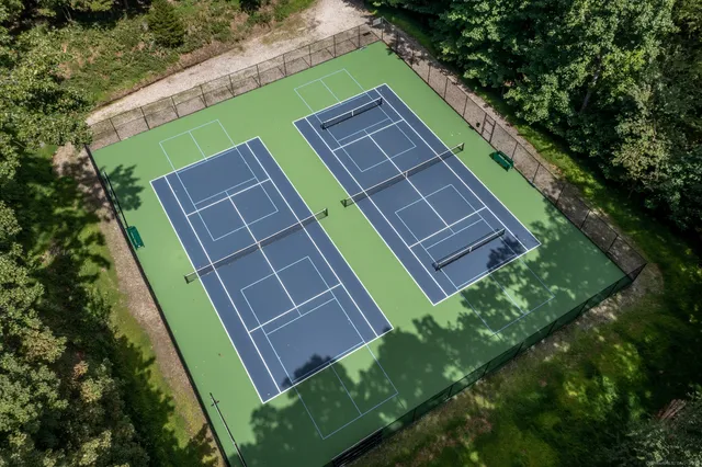a backyard of a house with outdoor seating and plants