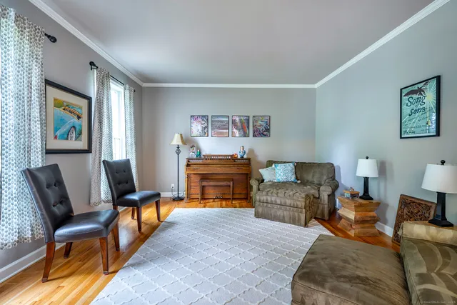 a bedroom with furniture and a lamp