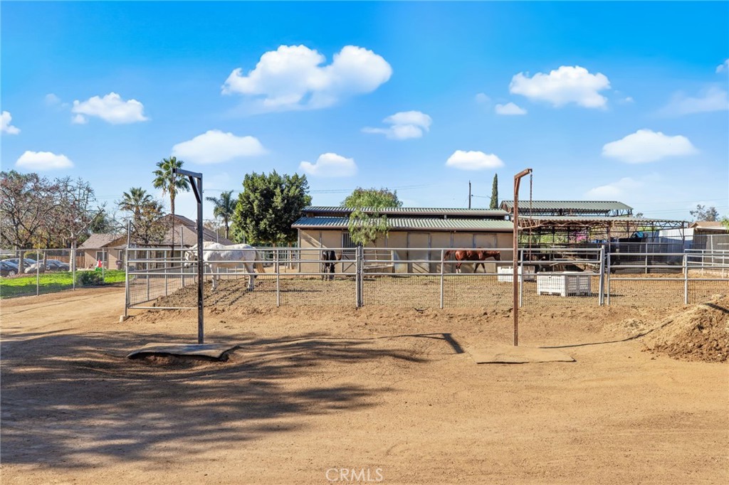 3243 Temescal Avenue Norco, CA 92860 - Photo 25 of 56 a view of a swimming pool with a table and chairs