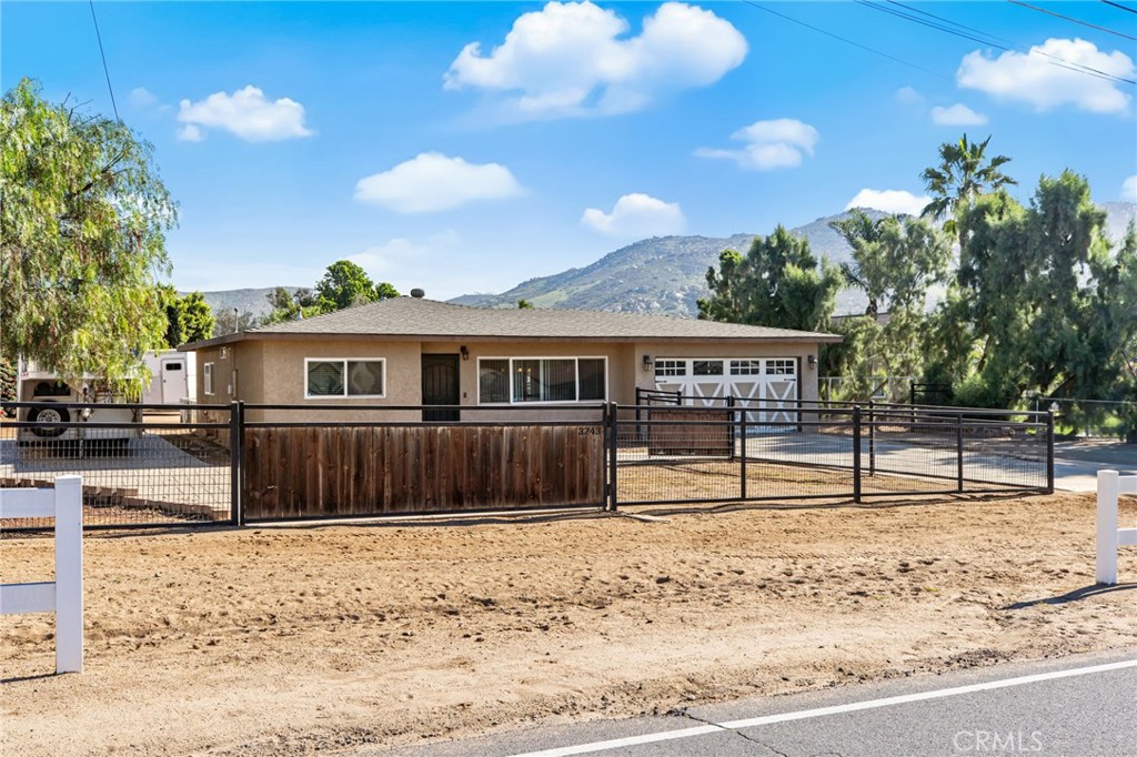 3243 Temescal Avenue Norco, CA 92860 - Photo 4 of 56 a house that has a tree in front of it