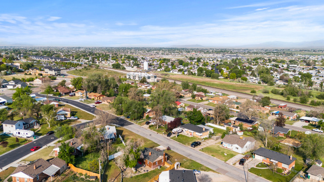 2101 West 3900th Street South Roy, UT 84067 - Photo 34 of 36 Aerial perspective showcasing an established residential area with single-story homes and mature landscaping
