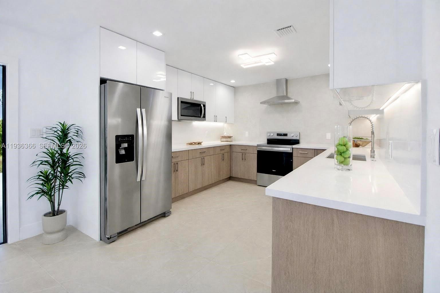 7904 Southwest 139th Court Miami, FL 33183 - Photo 1 of 33 a kitchen with stainless steel appliances a refrigerator a sink a stove and white cabinets