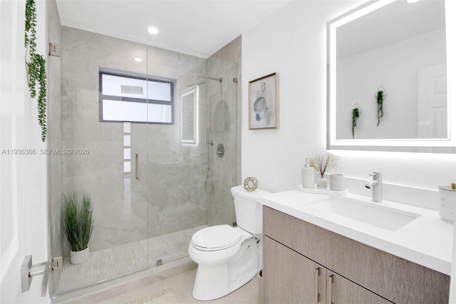 7904 Southwest 139th Court Miami, FL 33183 - Photo 14 of 33 a bathroom with a sink a toilet and shower