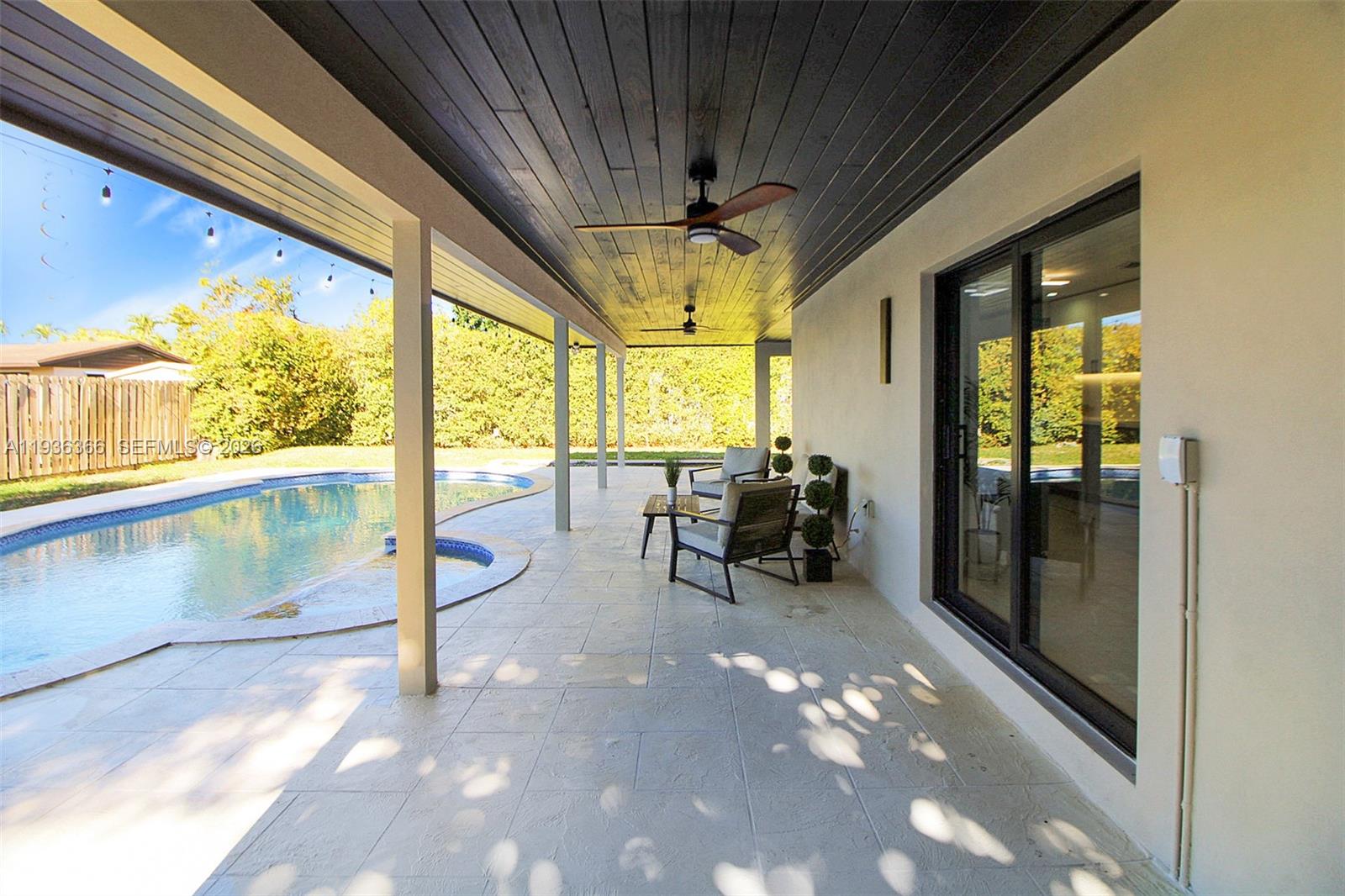 7904 Southwest 139th Court Miami, FL 33183 - Photo 26 of 33 a view of a porch with chairs and couches in the patio