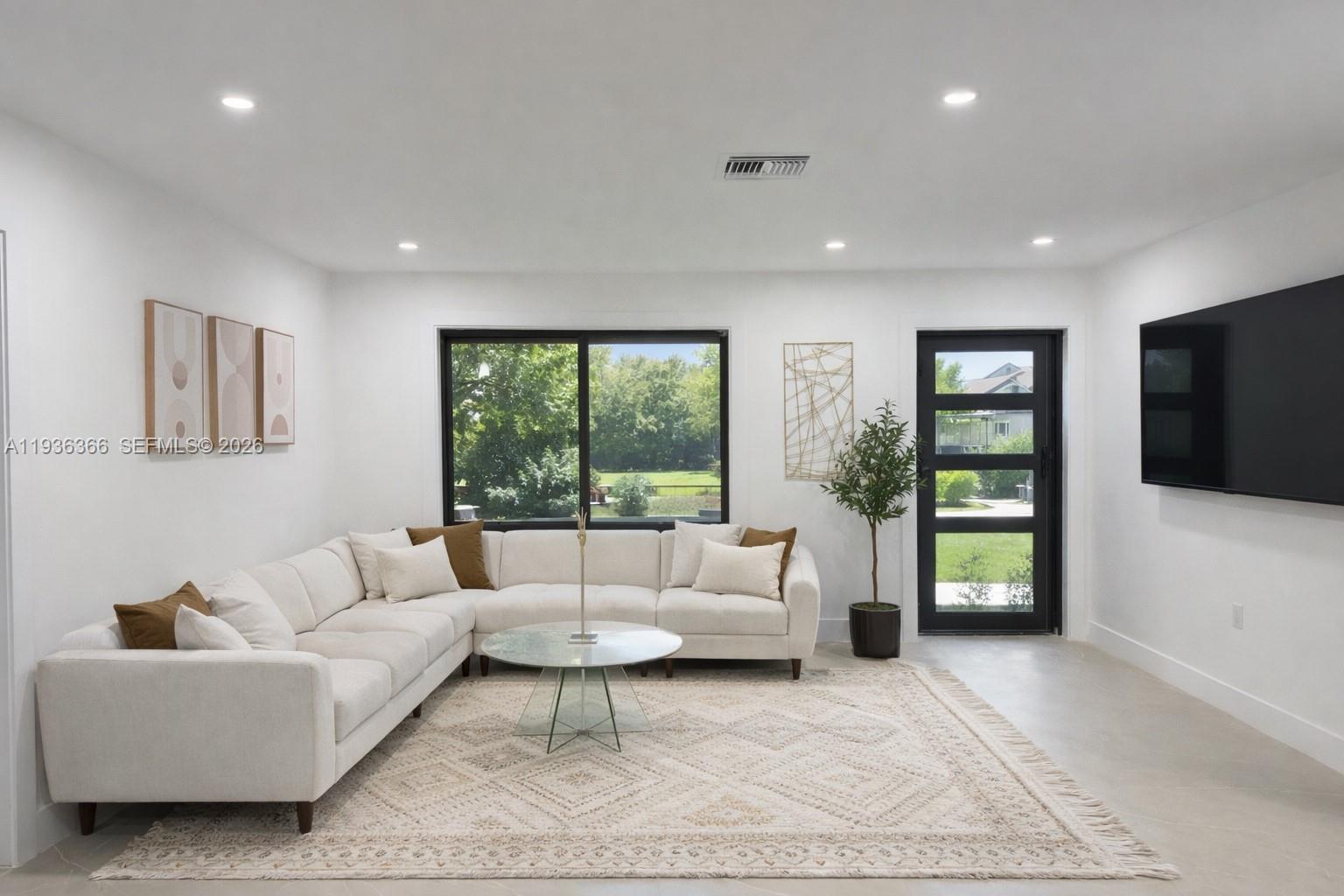 7904 Southwest 139th Court Miami, FL 33183 - Photo 3 of 33 a living room with furniture and a flat screen tv