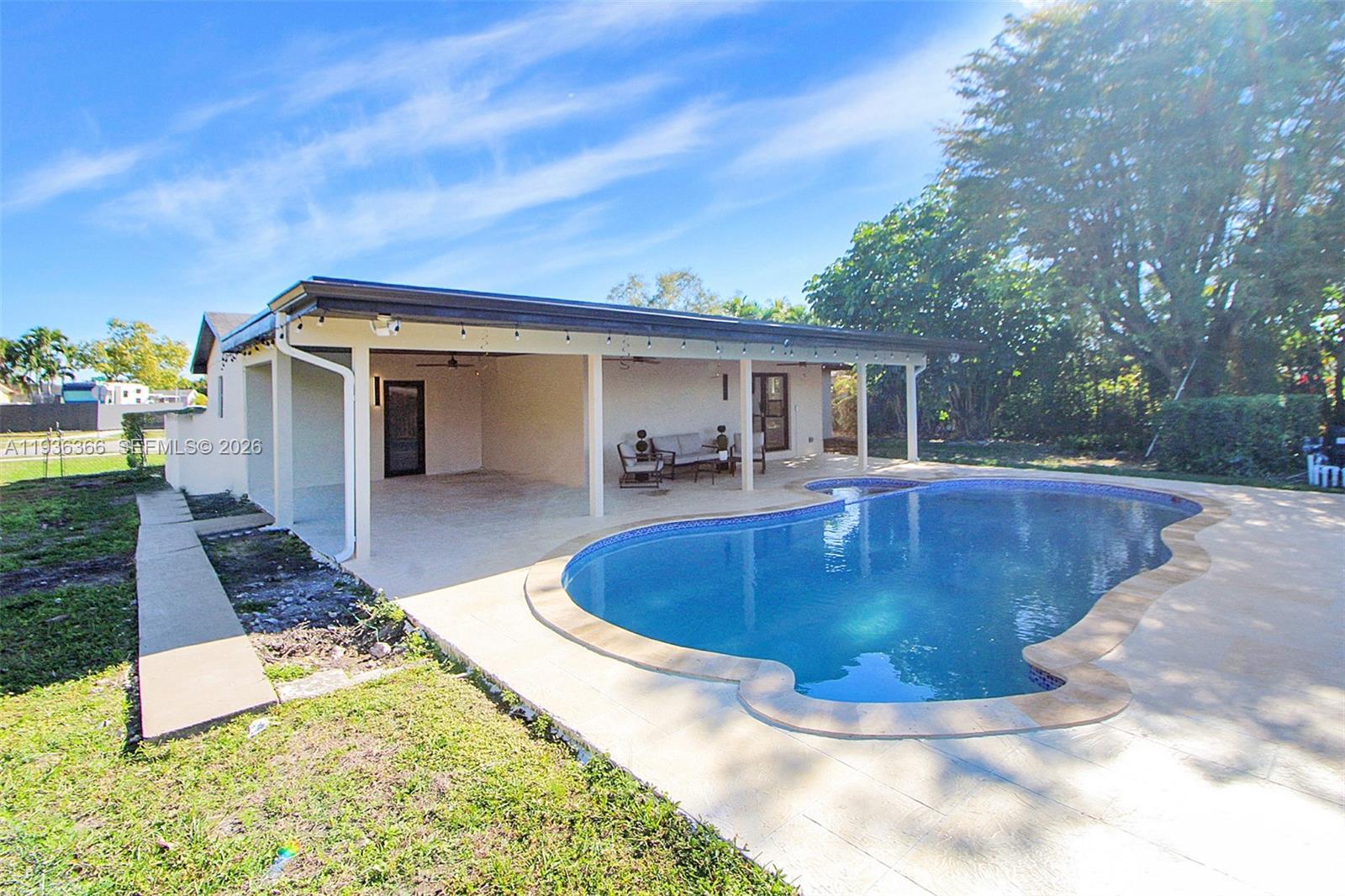 7904 Southwest 139th Court Miami, FL 33183 - Photo 31 of 33 a view of a backyard with swimming pool