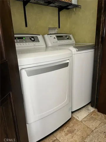 a kitchen with stainless steel appliances granite countertop a sink and a stove