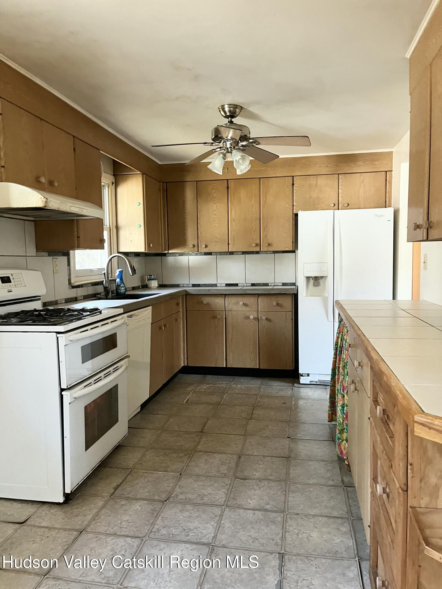 200 Van Vlierden Road Saugerties, NY 12477 - Photo 7 of 29 a kitchen with a stove a sink and a refrigerator