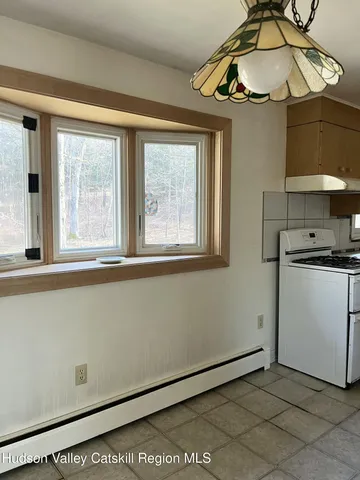 a kitchen with a stove a sink and a refrigerator