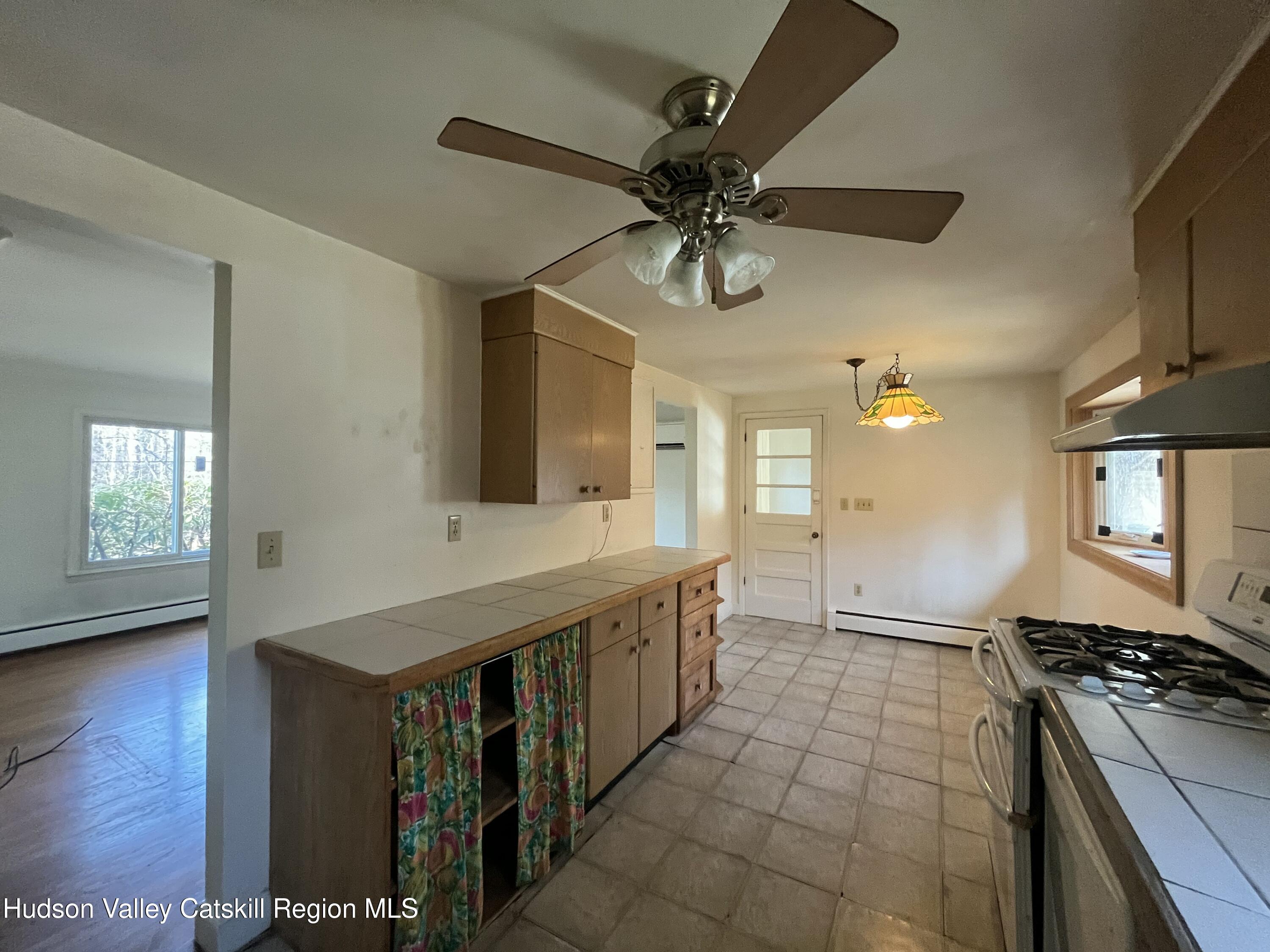 200 Van Vlierden Road Saugerties, NY 12477 - Photo 10 of 29 a kitchen with stainless steel appliances a stove a sink and a refrigerator