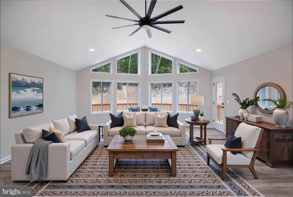 a view of cabinets a wooden floor and windows in a room