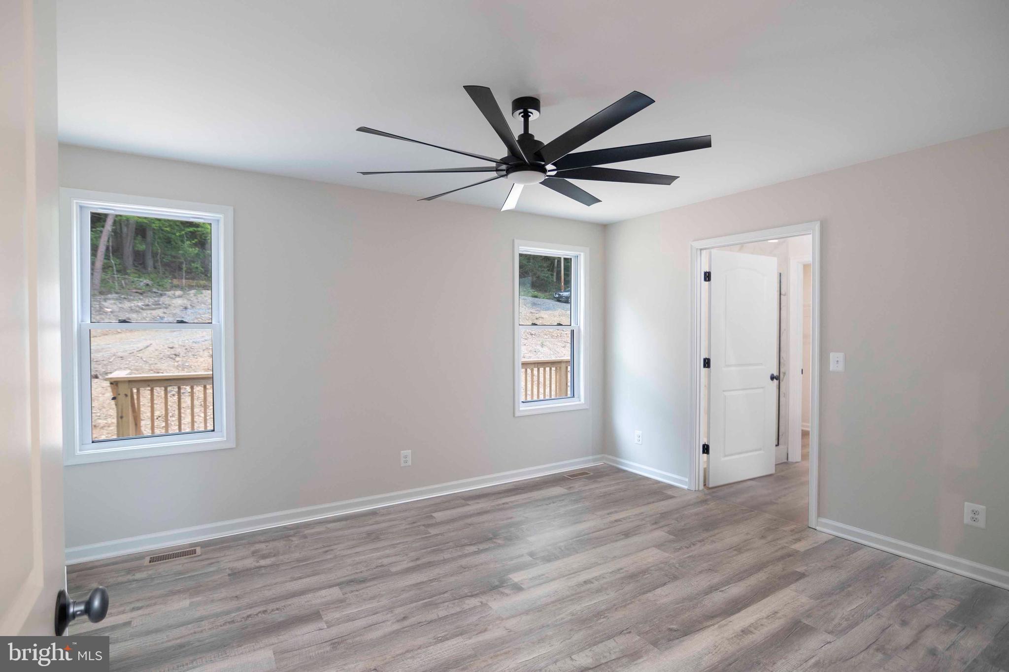 59 Old Oregon Road Front Royal, VA 22630 - Photo 18 of 76 a view of a big room with wooden floor and windows