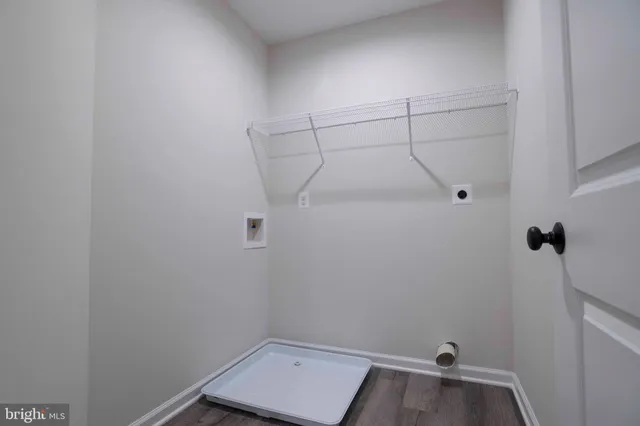 a view of a lake with houses in the back