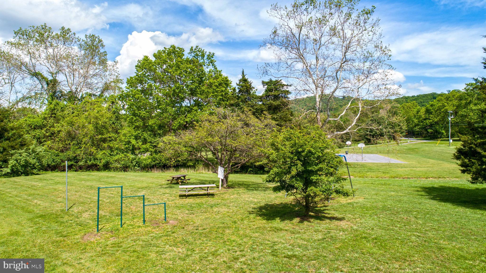 59 Old Oregon Road Front Royal, VA 22630 - Photo 62 of 76 a view of a garden with a bench