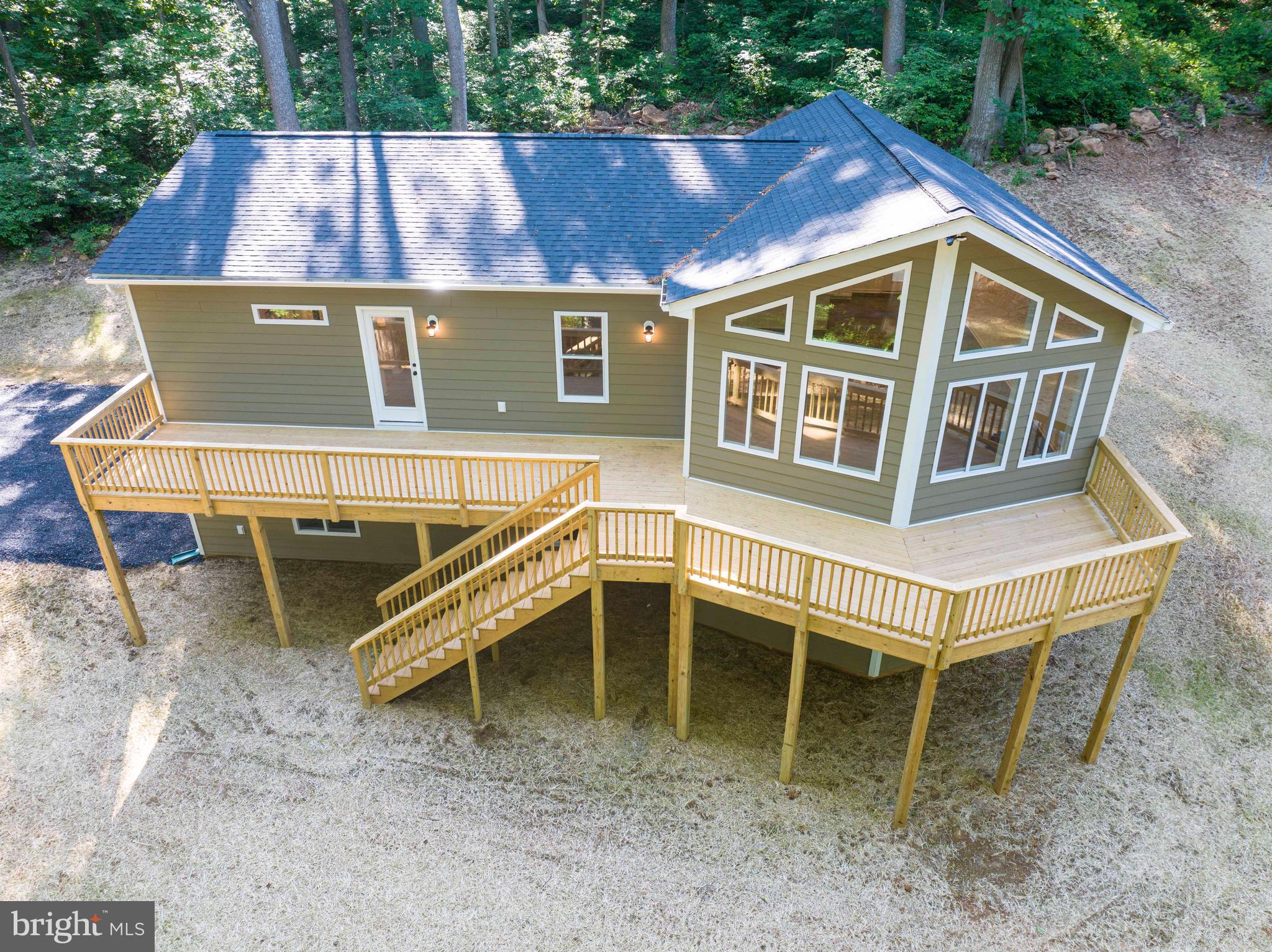 59 Old Oregon Road Front Royal, VA 22630 - Photo 7 of 76 a view of a house with a wooden deck