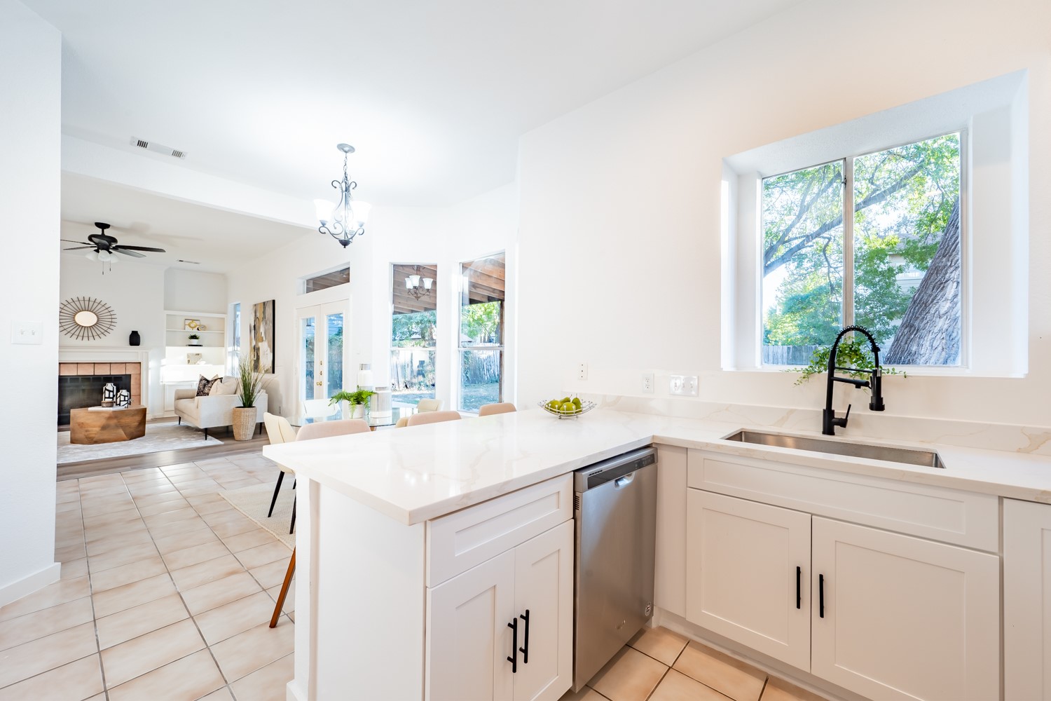 8111 Matchlock Cove Austin, TX 78729 - Photo 12 of 31 a kitchen with a sink cabinets and window