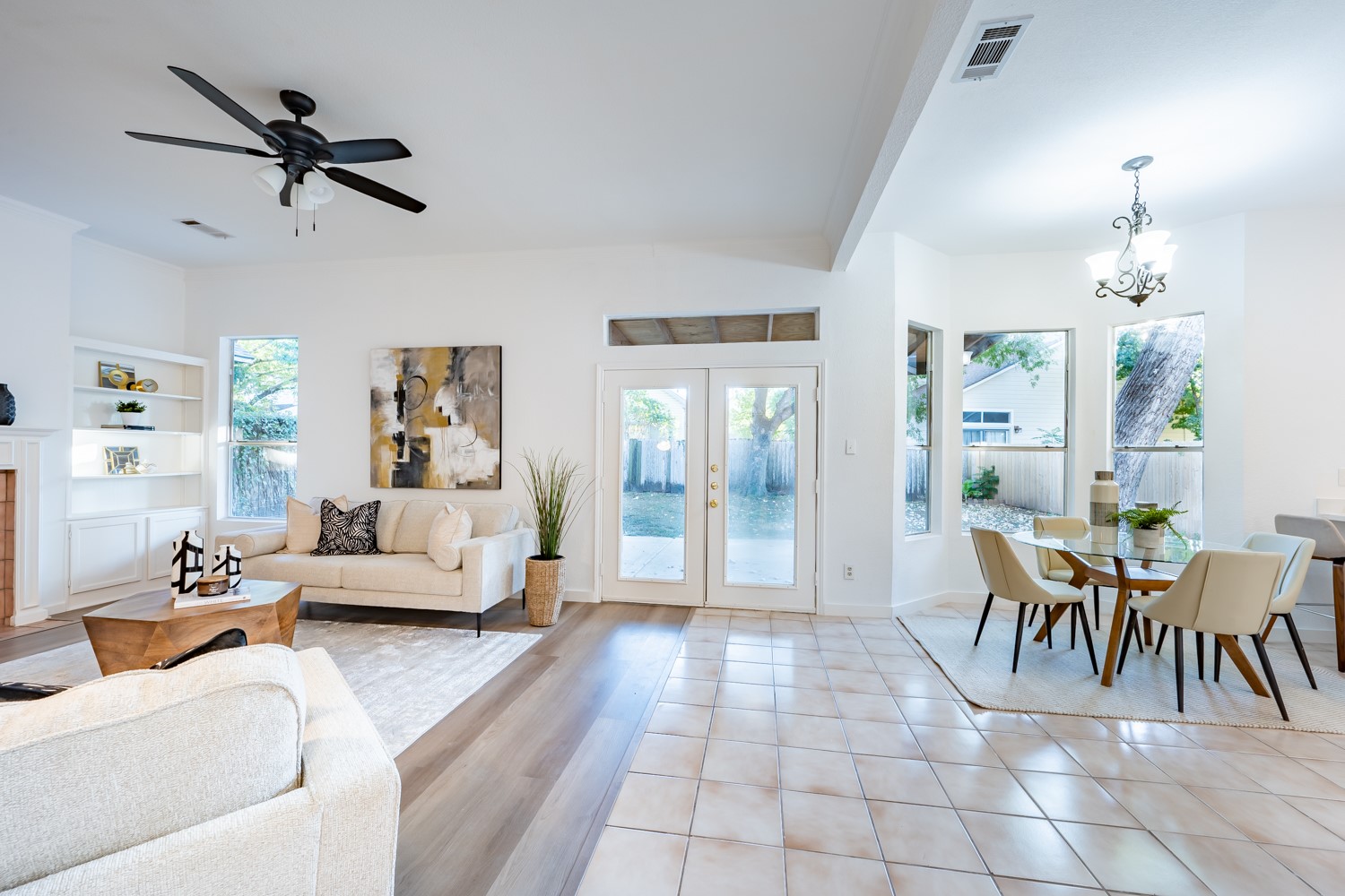 8111 Matchlock Cove Austin, TX 78729 - Photo 15 of 31 a living room with furniture and a chandelier