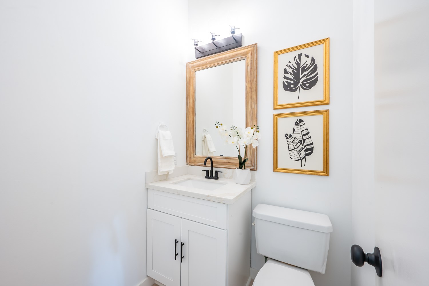 8111 Matchlock Cove Austin, TX 78729 - Photo 16 of 31 a bathroom with a toilet sink and mirror