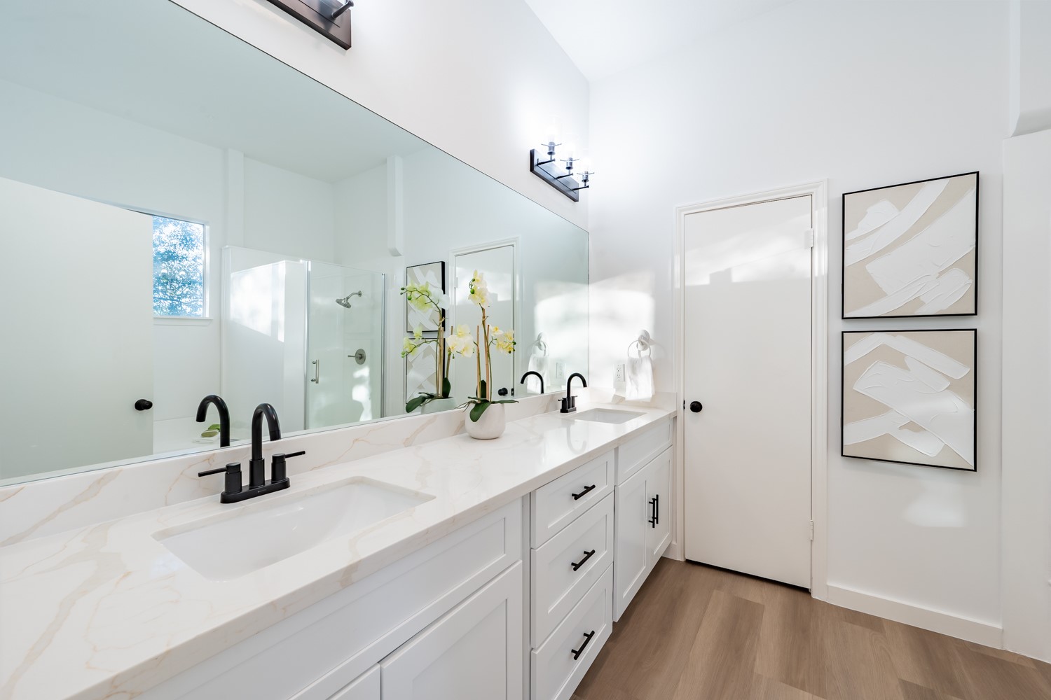 8111 Matchlock Cove Austin, TX 78729 - Photo 23 of 31 a bathroom with a double vanity sink and a mirror