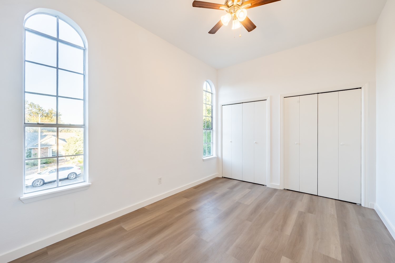 8111 Matchlock Cove Austin, TX 78729 - Photo 27 of 31 wooden floor in an empty room with a window