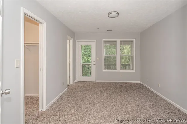 a view of a room that has a window in it