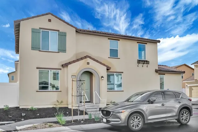 a front view of a house with parking space