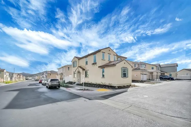 a view of a cars park in front of house