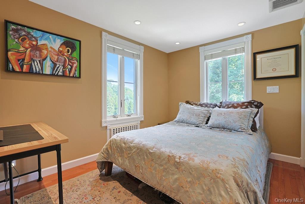 97 Underhill Road Scarsdale, NY 10583 - Photo 21 of 39 a bedroom with a bed and a window