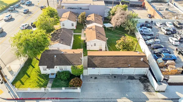 an aerial view of residential houses with outdoor space