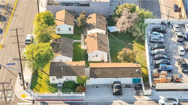 an aerial view of a house with a swimming pool
