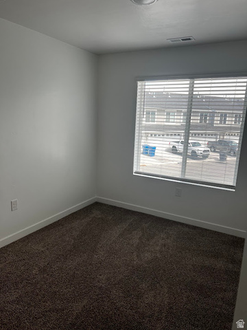 562 Hal Street, Unit 152 Tooele, UT 84074 - Photo 12 of 44 Room featuring neutral wall paint, dark pile carpeting, and white baseboards