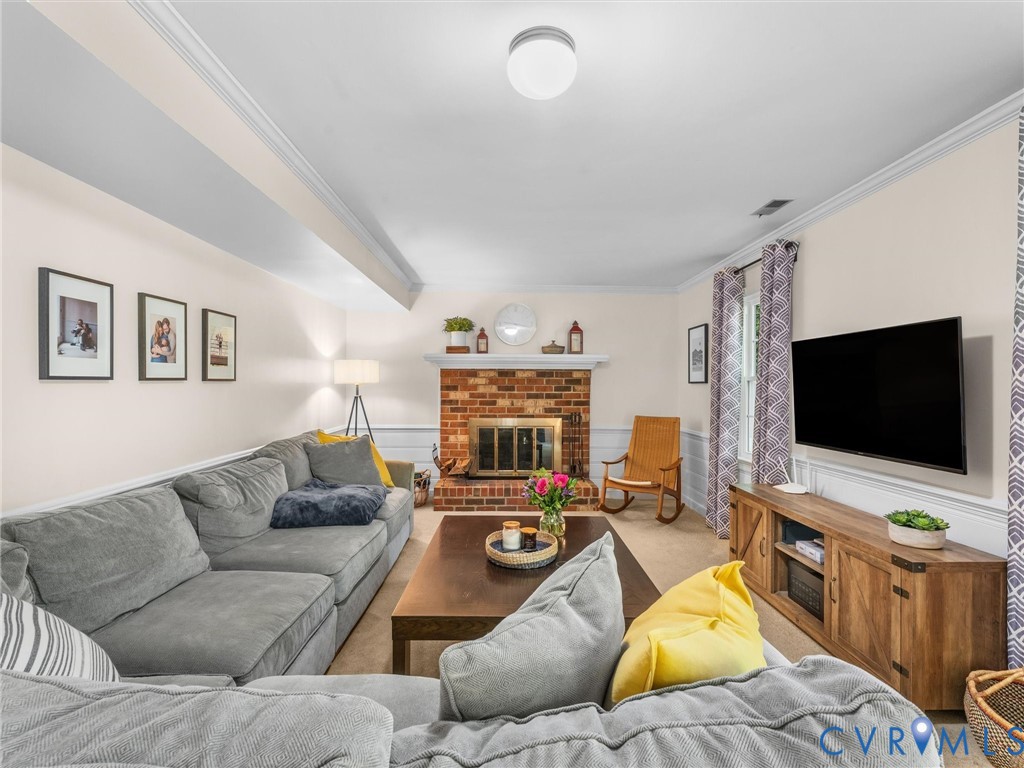 524 Glenmeadow Road Midlothian, VA 23114 - Photo 11 of 64 a living room with furniture and a flat screen tv