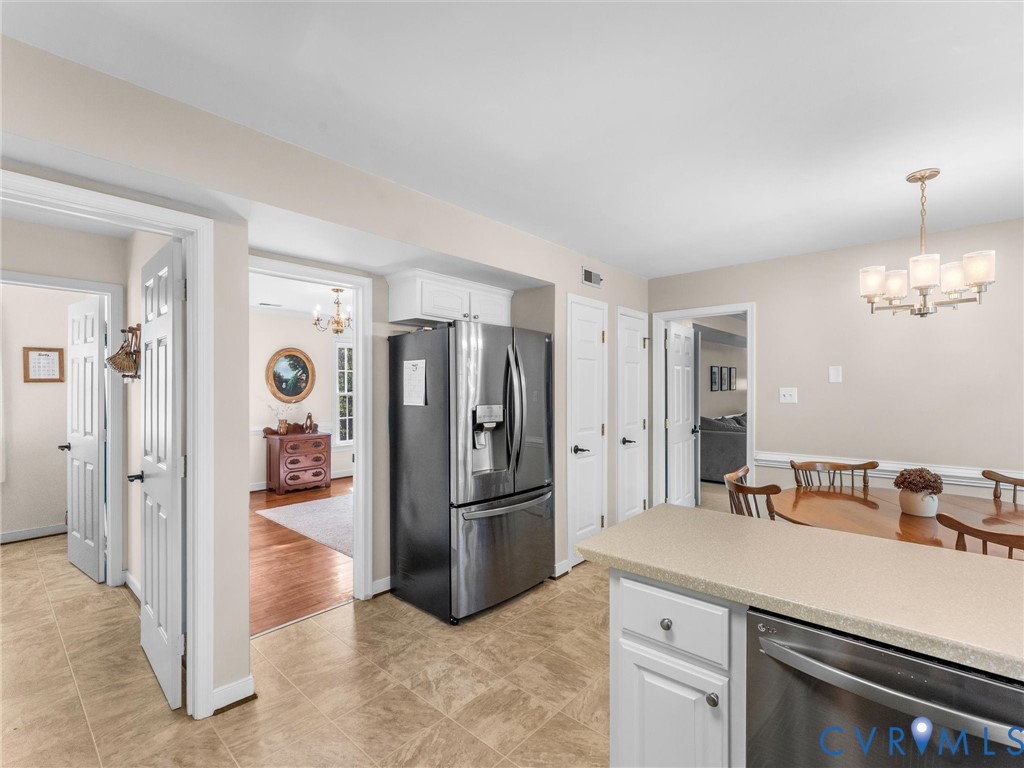 524 Glenmeadow Road Midlothian, VA 23114 - Photo 22 of 64 a kitchen with a refrigerator and a sink