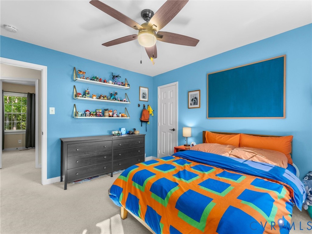 524 Glenmeadow Road Midlothian, VA 23114 - Photo 39 of 64 a bedroom with a bed and a dresser in it
