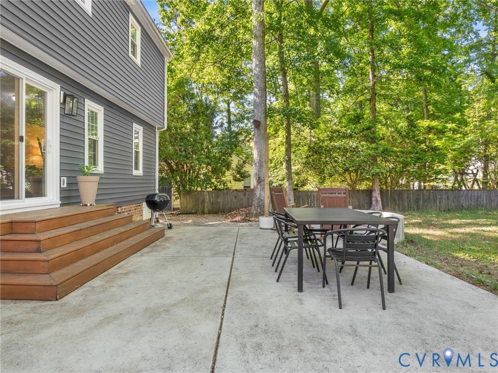524 Glenmeadow Road Midlothian, VA 23114 - Photo 52 of 64 a view of a patio with table and chairs and couches with wooden floor and fence