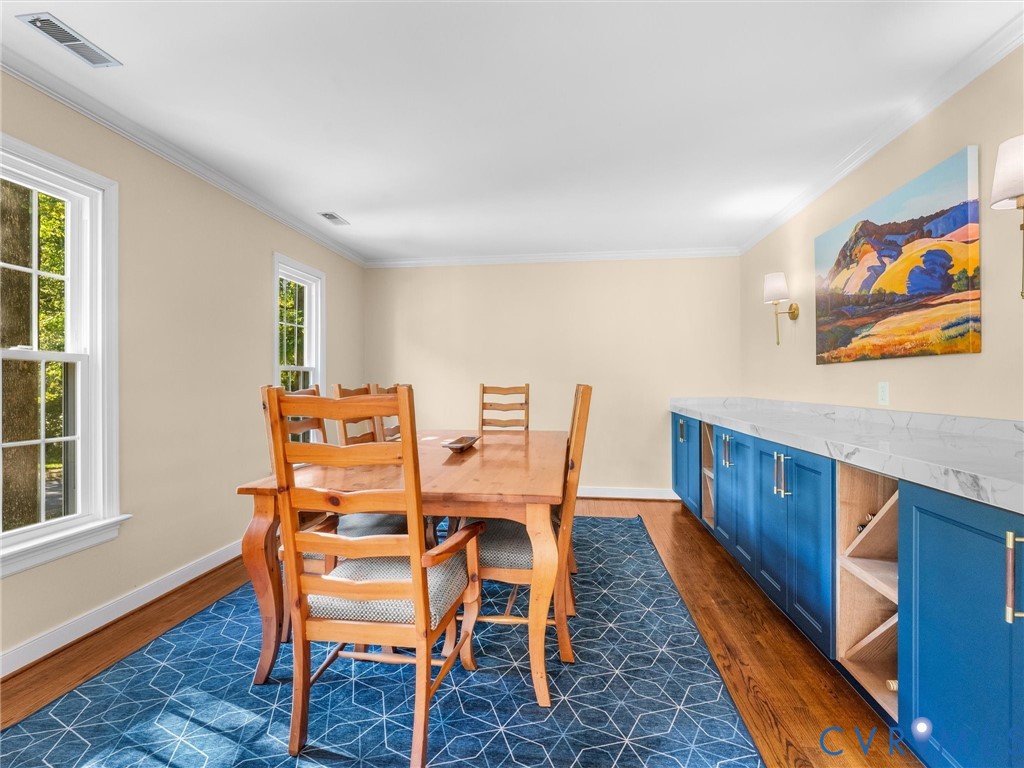524 Glenmeadow Road Midlothian, VA 23114 - Photo 8 of 64 a dining room with furniture and wooden floor