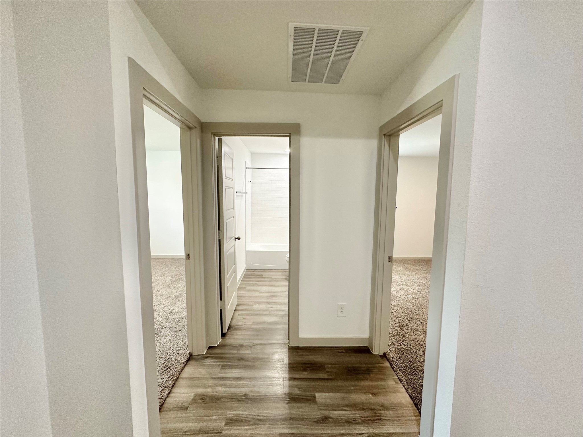 1107 Curly Angora Court Rosharon, TX 77583 - Photo 13 of 42 a view of a hallway with wooden floor