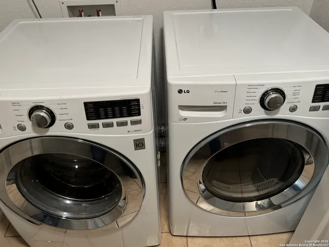 a utility room with dryer and washer