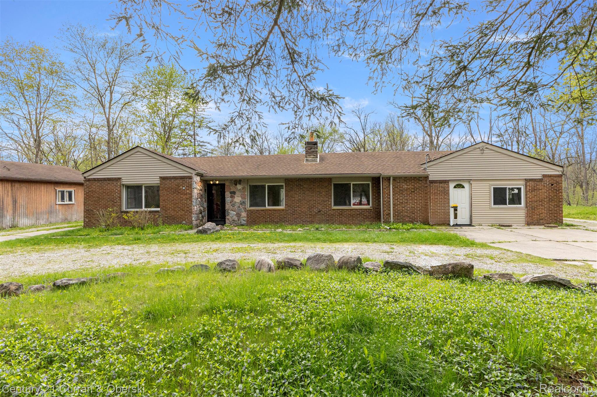 25205 Inkster Road Farmington, MI 48336 - Photo 5 of 46 Single story home with brick siding, a chimney, and a front yard