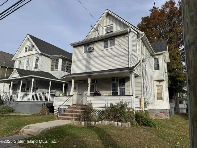 a front view of a house with garage