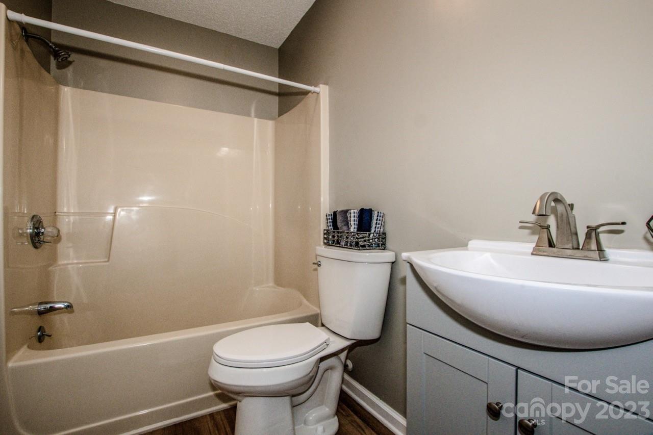 179 Isle Of Pines Road Mooresville, NC 28117 - Photo 13 of 25 a bathroom with a sink toilet and shower